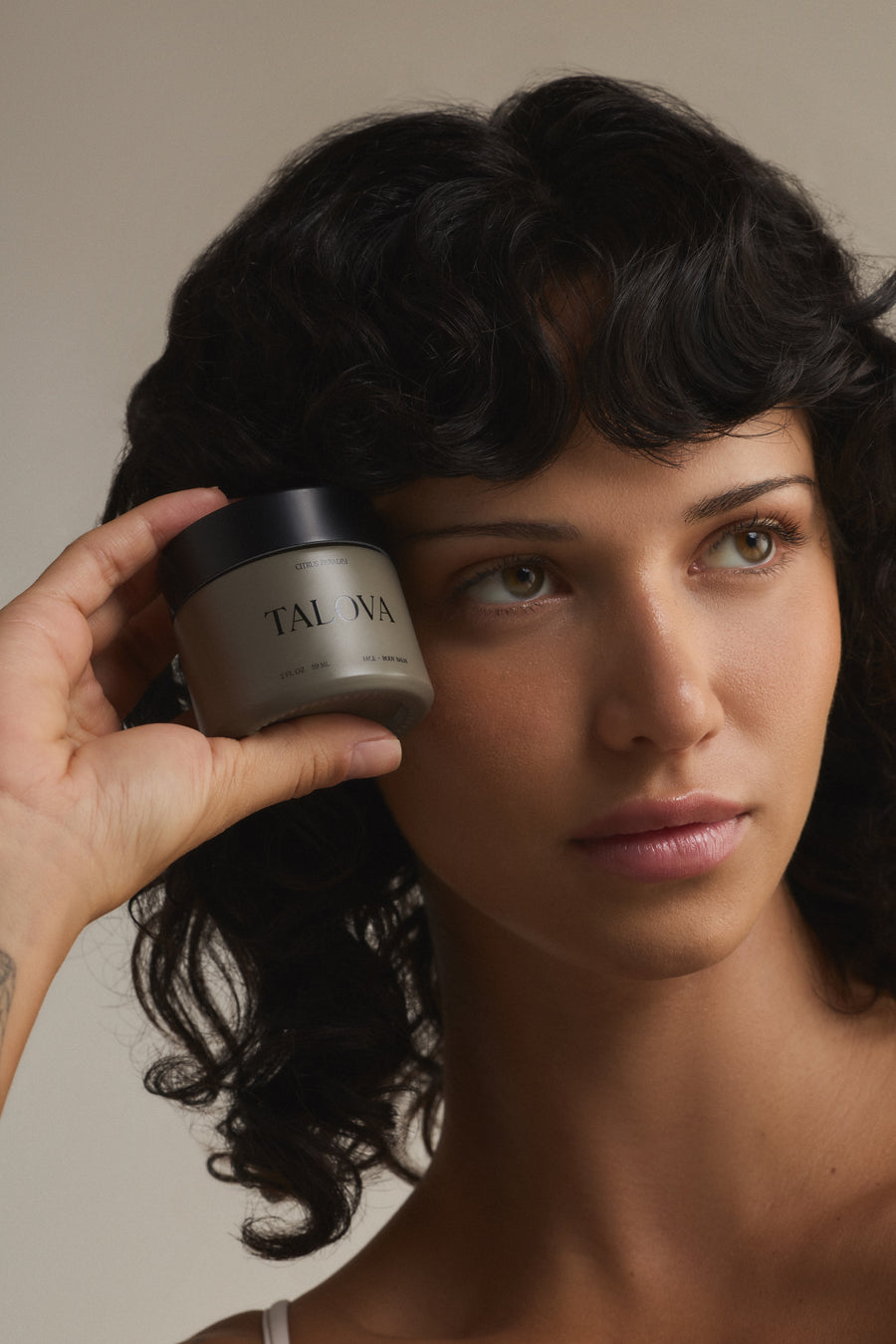 Applying Talova balm to the face