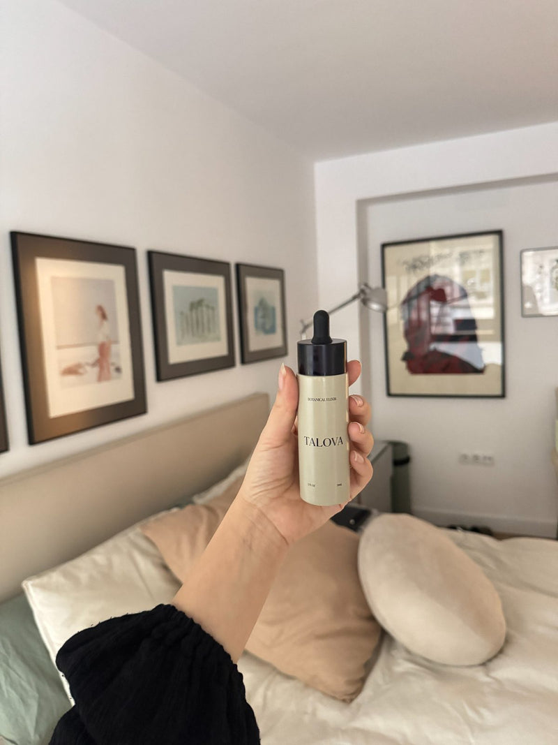 Holding the TALOVA Botanical Elixir