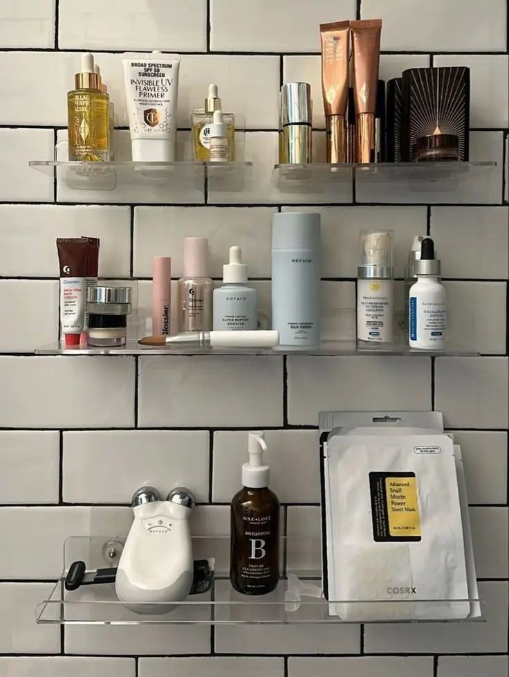A bathroom shelf crowded with products