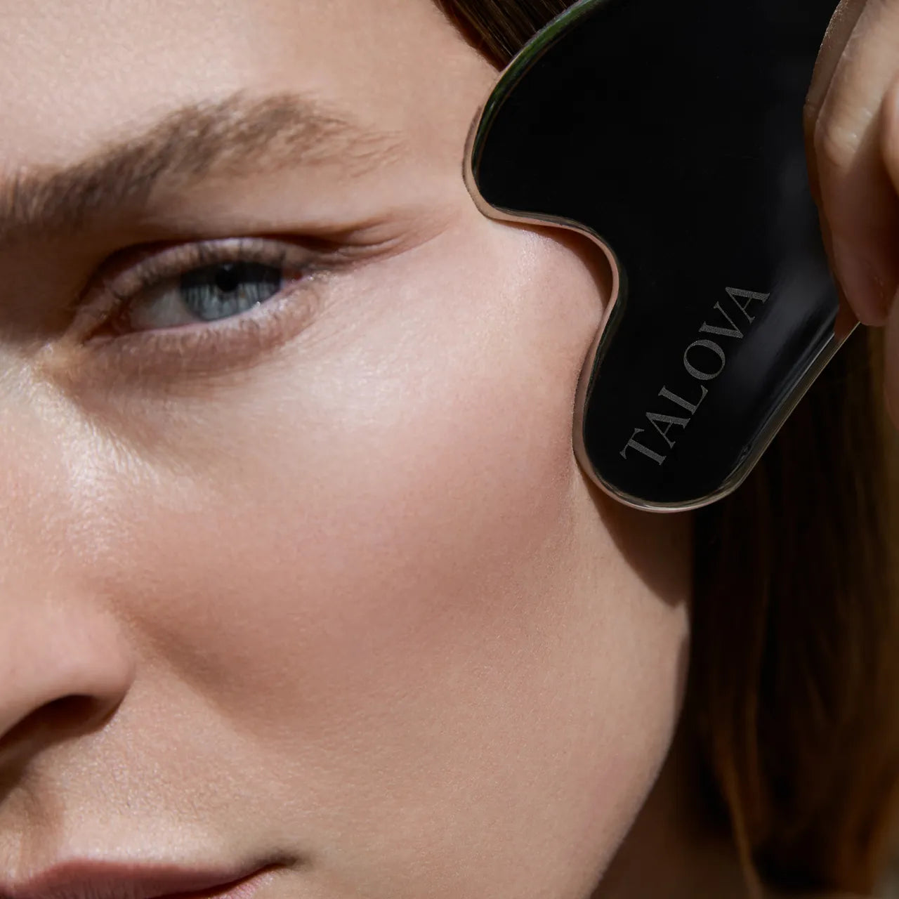 Using the gua sha along the jaw